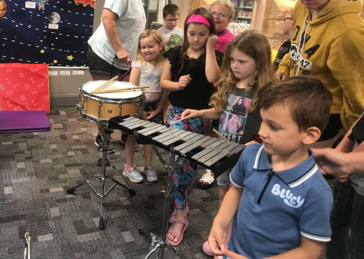 Children enjoyed the Instrument Petting Zoo provided by VSCSD Band Director hughes