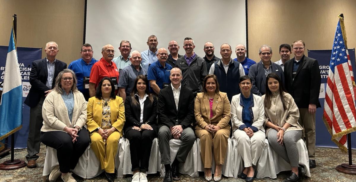 Pictured in the front row in the center is Secretary of Ag, Mike Naig. Directly behind him and to his right is Brian Carlson, Iowa Corn Producers. Click to read article