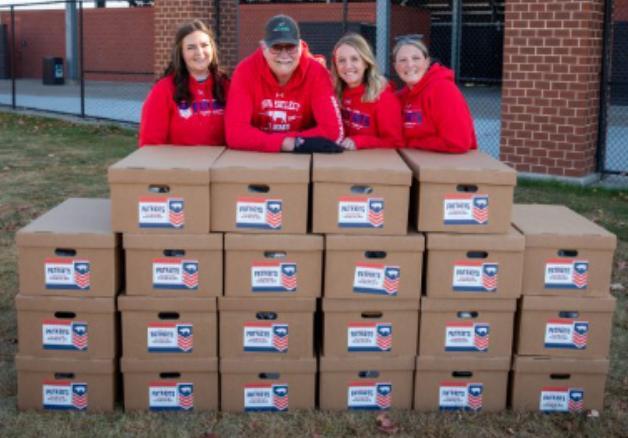 Iowa Select Farms employees with Pork for Patriots event kits, October 25. Kits included placemats, cups, centerpieces and decorations for local Veterans Day celebrations.