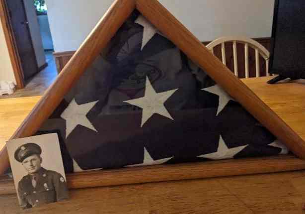 My Dad with his commemorative flag upon his death in 2001. 